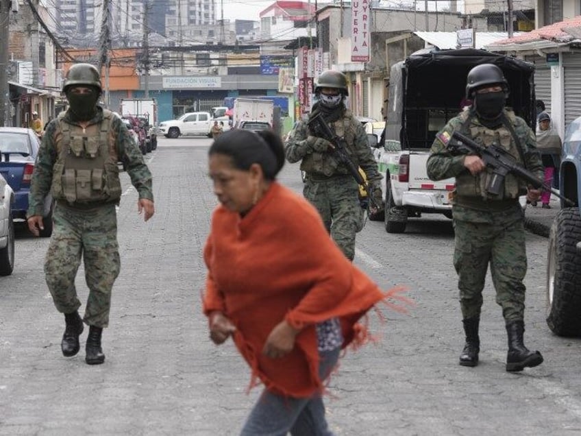 Soldiers patrol the perimeter of Inca prison during a state of emergency in Quito, Ecuador, Tuesday, Jauary 9, 2024, in the wake of the apparent escape of a powerful gang leader from prison. President Daniel Noboa decreed Monday a national state of emergency, a measure that lets authorities suspend people’s …
