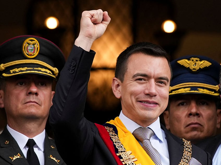 Newly sworn-in President Daniel Noboa waves from a balcony of the Carondelet presidential palace in Quito, Ecuador, Thursday, Nov. 23, 2023. (AP Photo/Carlos Noriega)