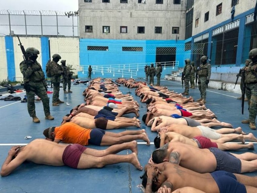 Ecuador's army shared images of hundreds of inmates, shirtless and barefoot, lying on the ground