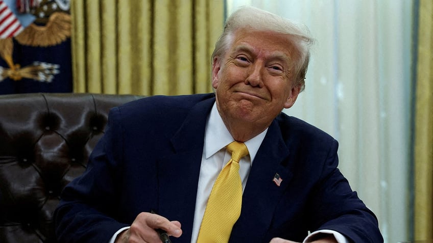 Donald Trump sits in the Oval Office in Washington D.C.