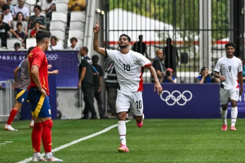 Ibrahim Adel celebrates after scoring one of his two goals for Egypt against Spain in Bord