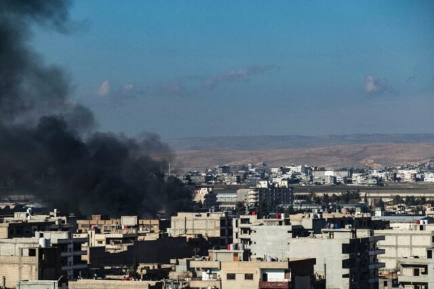 Smokes billows in Qamishli in northeastern Syria close to the Turkish border amid Turkish strikes