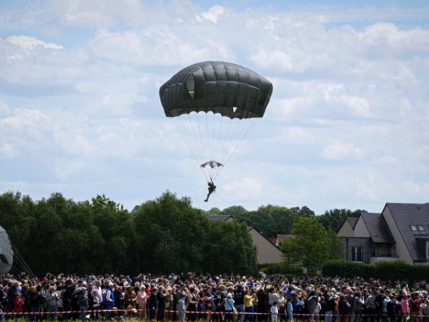 eight congressmen parachute jump out of plane over normandy to honor d day