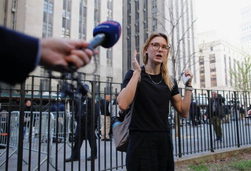 Kara McGee an excused juror, speaks to the media outside Manhattan Criminal Court in New Y