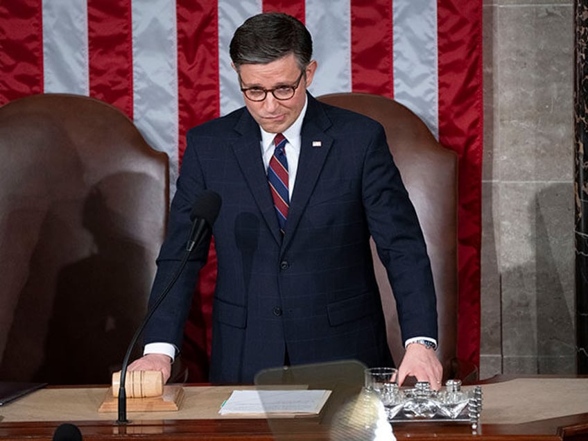 Speaker of the House Mike Johnson, R-La., waits to raise the gavel to formally conclude a