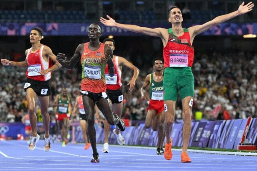 Morocco's Soufiane El Bakkali celebrates after winning the men's 3000m steeplechase final