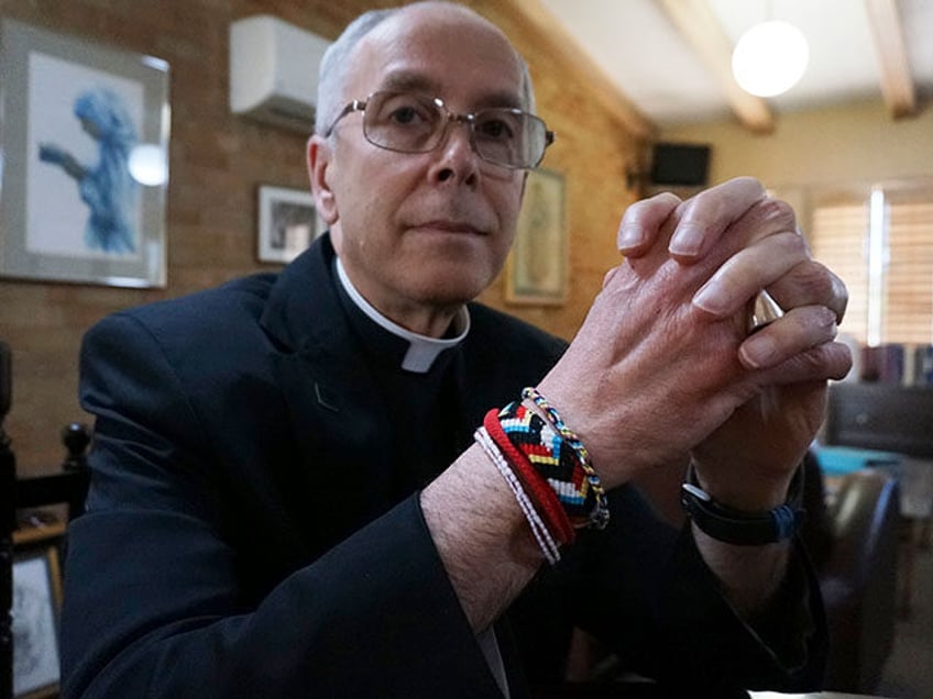 Bishop Mark Seitz of El Paso sits for a portrait in his office in El Paso, Texas, on April