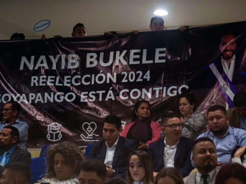 SAN SALVADOR, EL SALVADOR - JUNE 01: People show support to the Salvadoran president, Nayib Bukele, with a banner with the text in Spanish 'Nayib Bukele, Reelection 2024, Soyapango Is With You' during a report to the nation for the 4th year of the current presidential administration in the plenary session at the Legislative Assembly on June 1, 2023 in San Salvador, El Salvador. President of El Salvador Nayib Bukele marks his fourth year of government on June 1 as he seeks re-election in the 2024 elections for a further 5-year period, despite accusations of being unconstitutional. (Photo by Alex Peña/Getty Images)