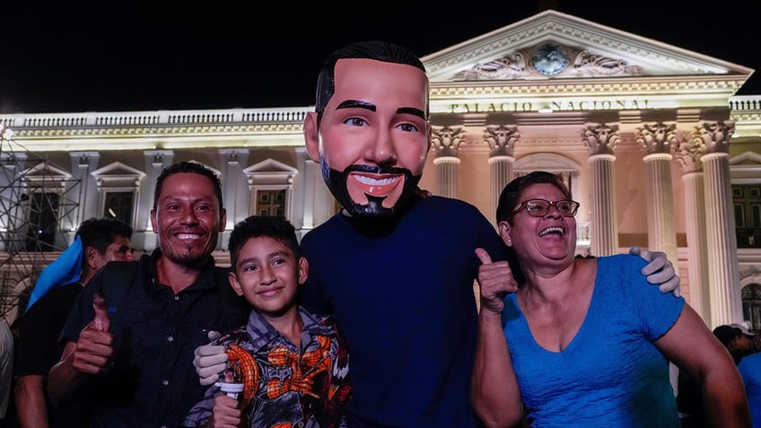 Bukele supporter in a mask of the president