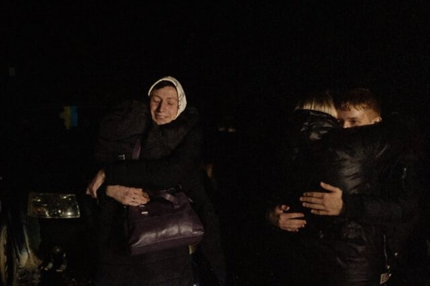 Oleksandr (L), 16, who was kept at a state boarding school in Russian-occupied Lugansk, hu