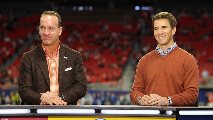 Peyton and Eli Manning sitting