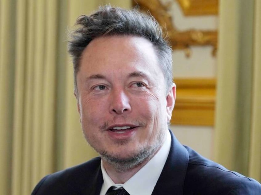 FILE - Twitter, now X Corp., and Tesla CEO Elon Musk poses prior to his talks with French