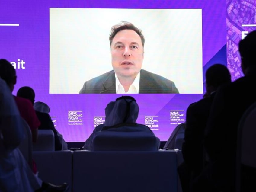 Elon Musk, chief executive officer of Tesla Inc., speaks via video link during the Qatar E