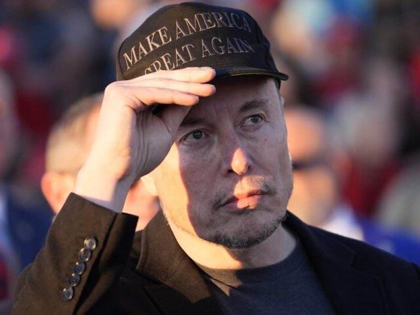 Tesla and SpaceX CEO Elon Musk listens as Republican presidential nominee former President