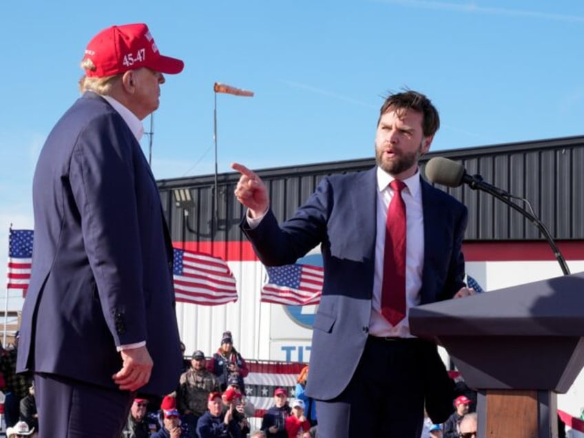 FILE - Sen. J.D. Vance, R-Ohio, right, points toward Republican presidential candidate for