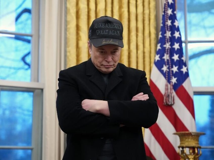 Elon Musk looking glum in Oval Office