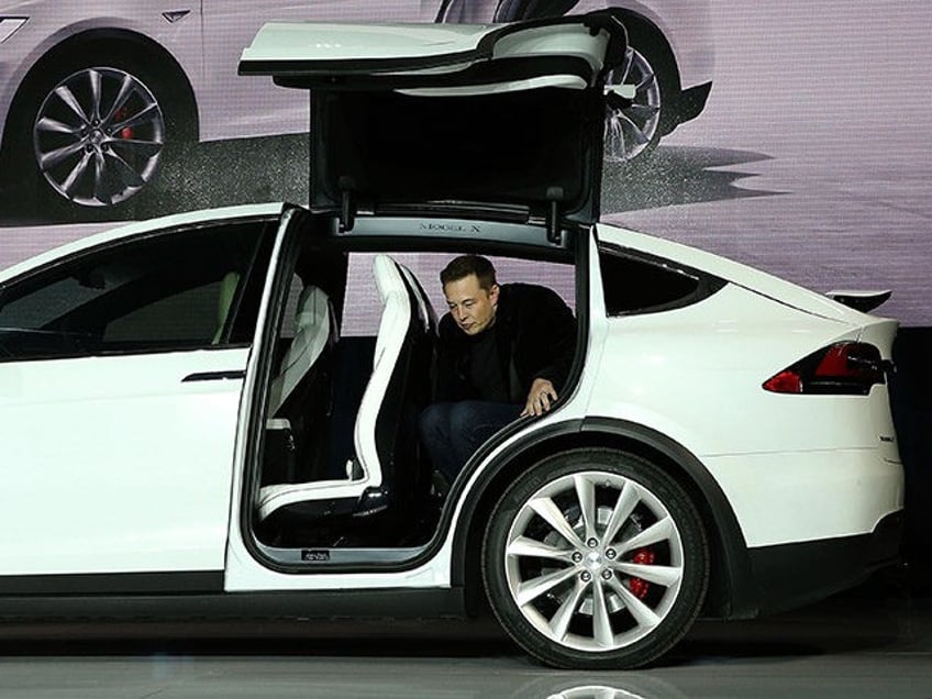 FREMONT, CA - SEPTEMBER 29: Tesla CEO Elon Musk steps out of the new Tesla Model X during an event to launch the company's new crossover SUV on September 29, 2015 in Fremont, California. After several production delays, Elon Musk officially launched the much anticipated Tesla Model X Crossover SUV. …