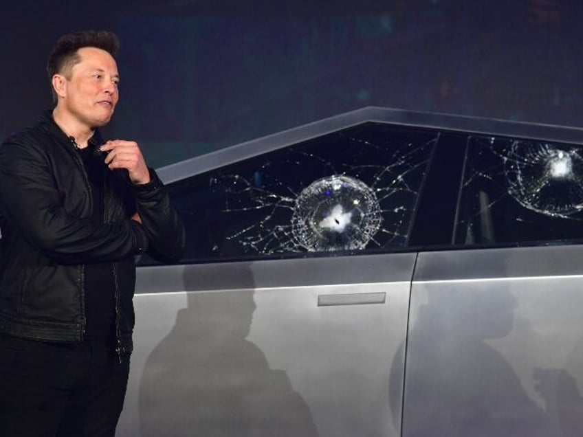 Elon Musk with his battered Cybertruck
