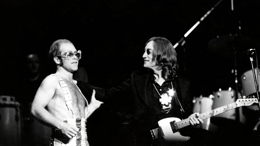 John Lennon (right) makes a surprise appearance at a concert by Elton John at Madison Square Garden