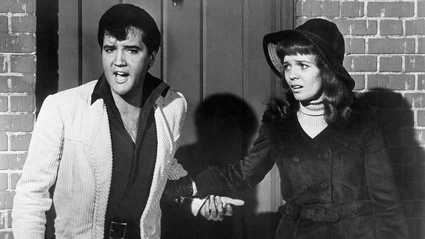 Elvis Presley acting out a scene in Double Trouble