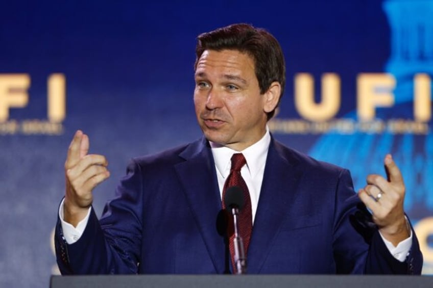 embattled desantis tries to hit reset in interview overshadowed by trump