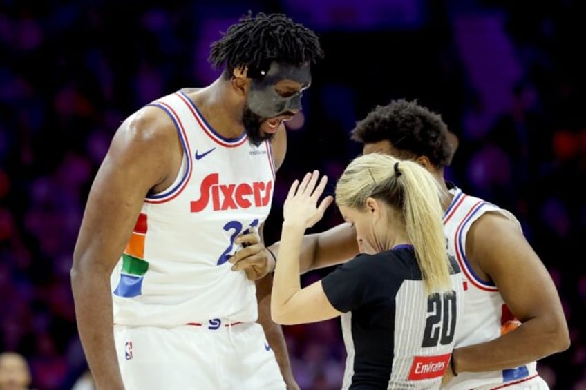 Philadelphia's Joel Embiid, left, argued a foul call by referee Jenna Schroeder before he