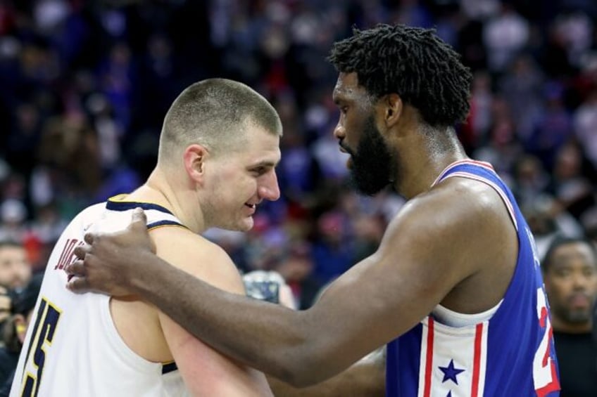 Joel Embiid (right) shares a moment with Nikola Jokic (left) after Philadelphia's victory over Denver on Tuesday