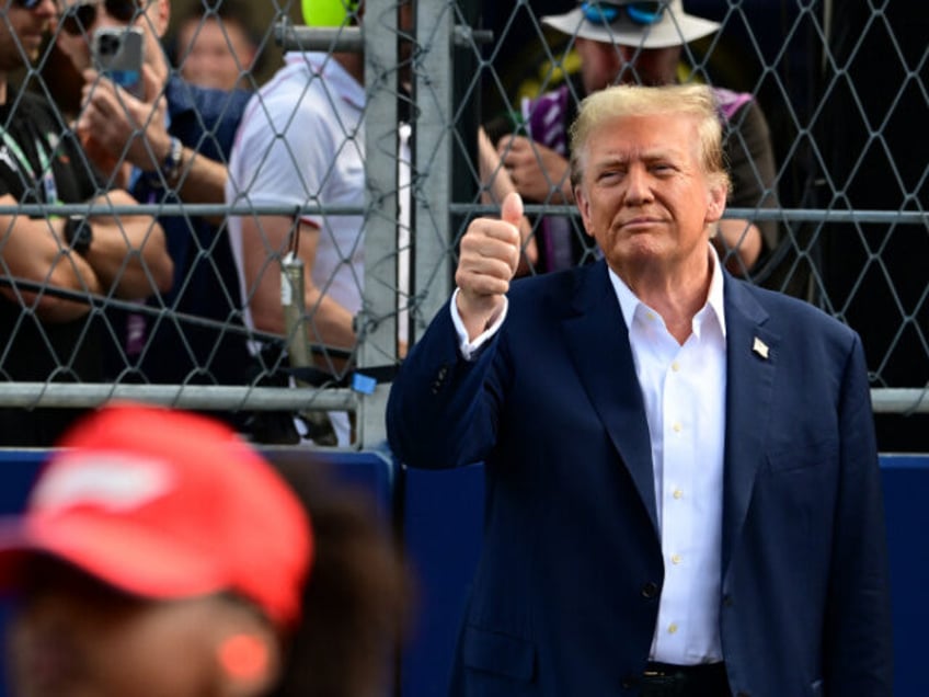 Former US President and 2024 presidential candidate Donald Trump gives a thumbs up before