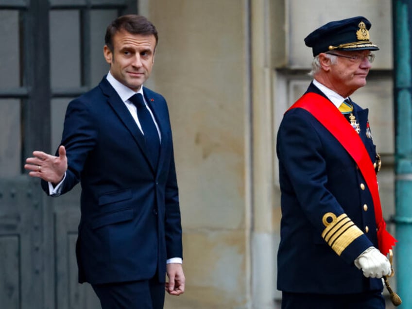 French President Emmanuel Macron (L), waves as he and King Carl XVI Gustaf of Sweden walks in the palace courtyard during an official welcoming ceremony at the Royal Palace in Stockholm, Sweden on January 30, 2024. French President Macron pays a two-day state visit to Sweden, which applied to join …