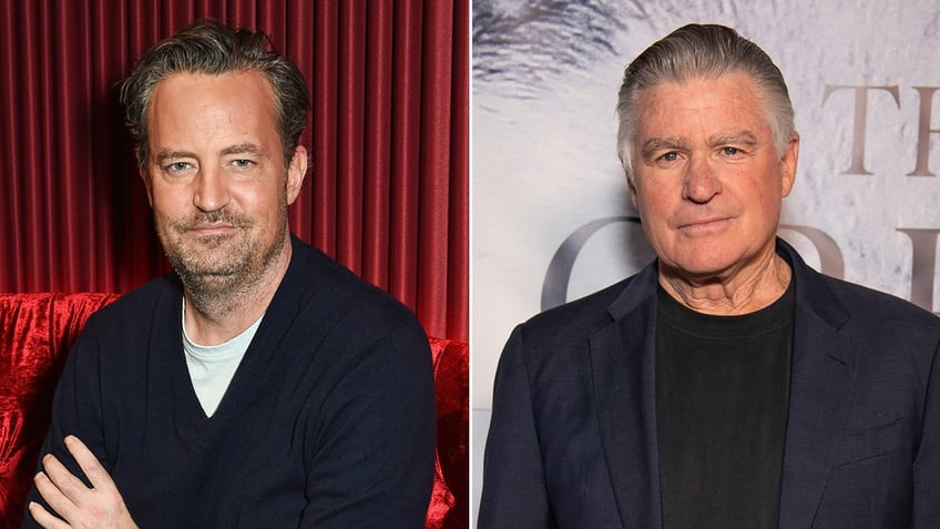 Matthew Perry in a navy sweater soft smiles with his arms crossed split Treat Williams in a navy suit on the carpet