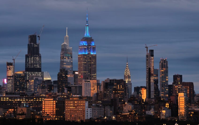 JERSEY CITY, NJ - SEPTEMBER 7: The sun sets on the skyline of midtown Manhattan as the Emp