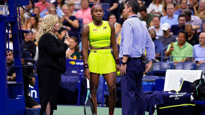 end fossil fuels protesters disrupt us open semifinal match demonstrator glues shoes to ground