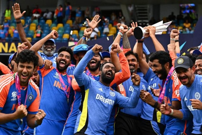 Team India celebrates with the trophy after winning the ICC men's Twenty20 World Cup 2024
