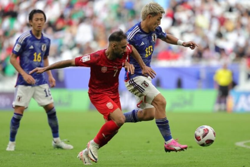 Japan beat Bahrain in their Asian Cup last 16 game in Doha to set up a quarter-final against either Iran or Syria