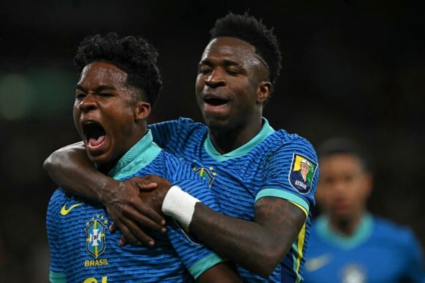 Brazil's Endrick (L) celebrates with Vinicius Junior after his winner against England