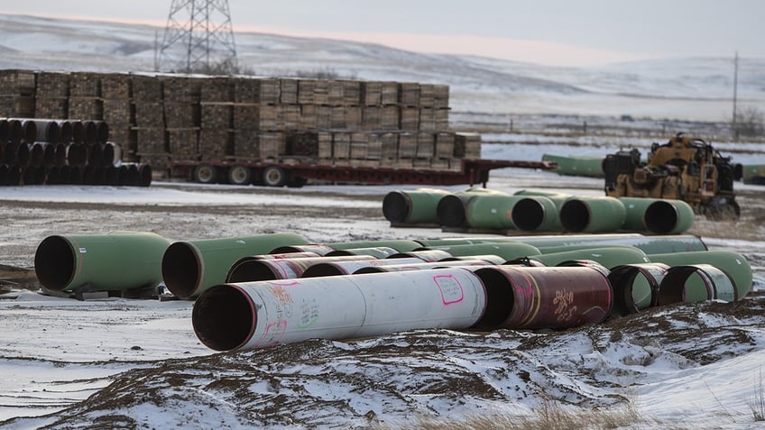 Pipes for the Keystone XL pipeline stacked in a yard near Oyen, Alberta, Canada, on Tuesday, Jan. 26, 2021. Former President Joe Biden revoked the permit for TC Energy Corp.'s Keystone XL energy pipeline via executive order hours after his inauguration.