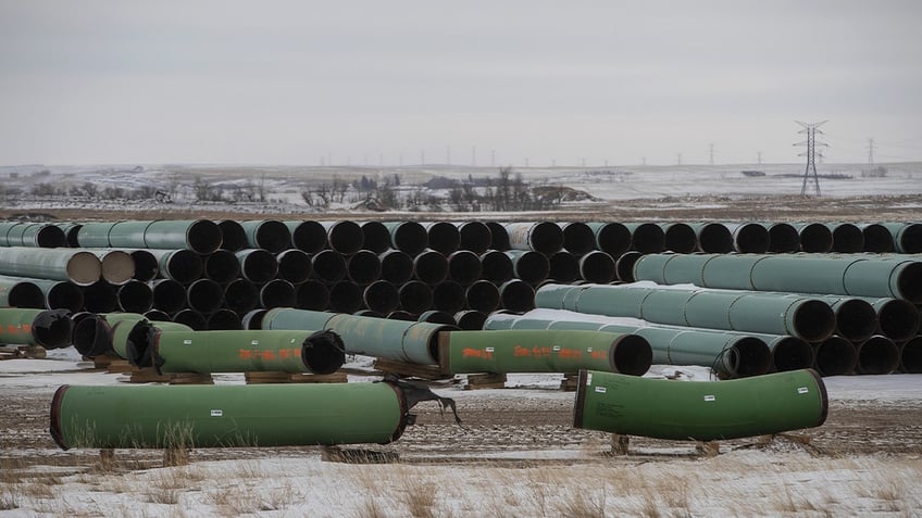 Pipes for the Keystone XL pipeline stacked in a yard near Oyen, Alberta, Canada, on Tuesday, Jan. 26, 2021.