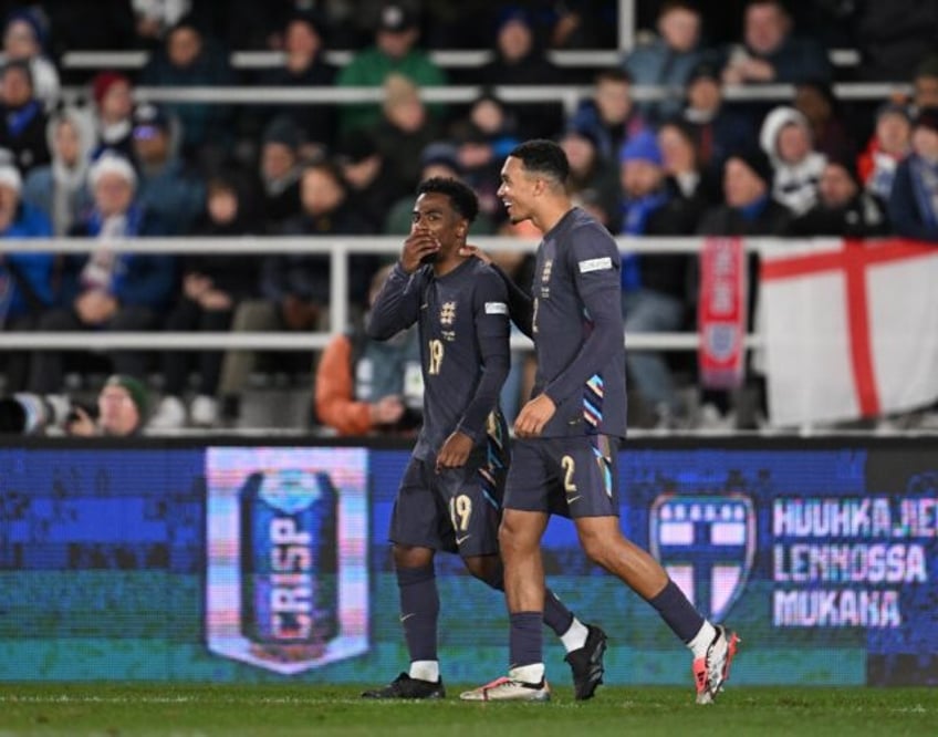 England's Trent Alexander-Arnold (R) celebrates his goal against Finland