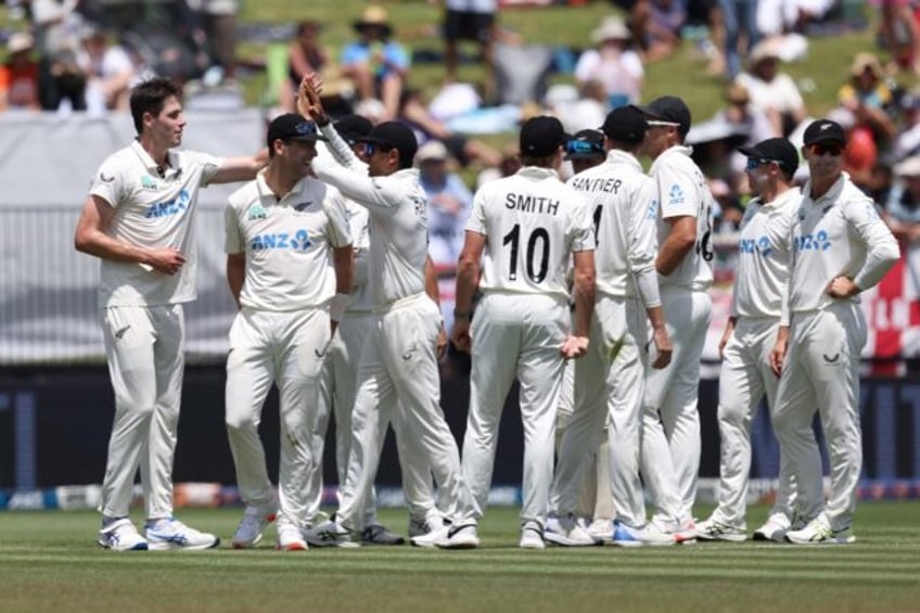 New Zealand’s Will O’Rourke (L) celebrates the wicket of England’s Harry Brook