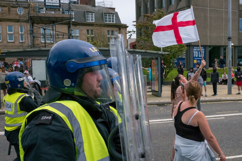 SUNDERLAND, ENGLAND - AUGUST 02: Riot police are confronted by Far-right activists during an Enough is Enough protest in Sunderland on August 02, 2024 in Sunderland, England. Mis-information spread on social media after the murders of three girls in Southport earlier this week has fueled acts of violent rioting from far-right sympathisers across England. (Photo by Ian Forsyth/Getty Images)