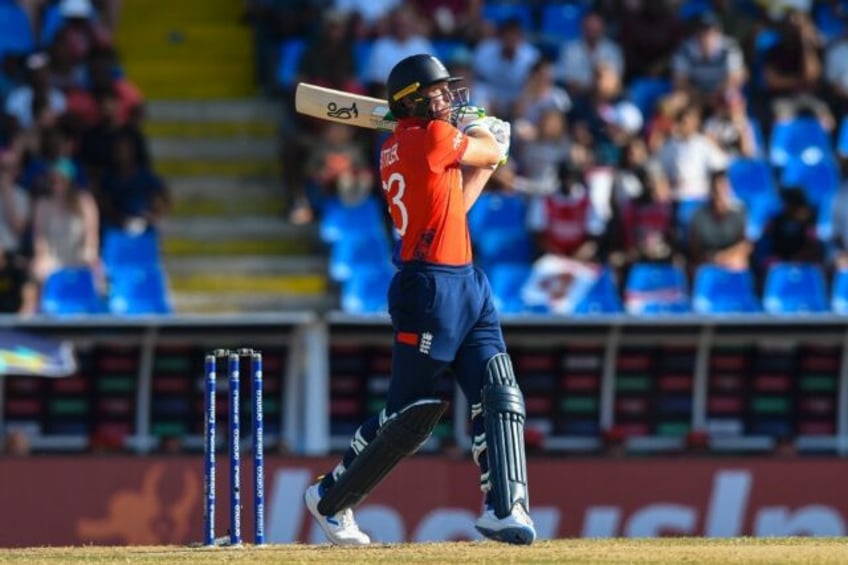 On the attack: England captain Jos Buttler hits a six during an eight-wicket rout of Oman