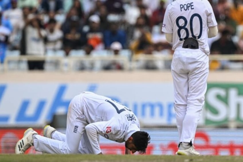 England's Shoaib Bashir prays after taking the wicket of India's Akash Deep during the thi