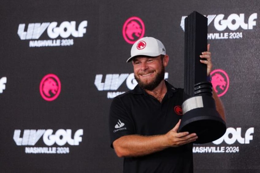 England's Tyrrell Hatton holds the winner's trophy after his first LIV Golf victory came o