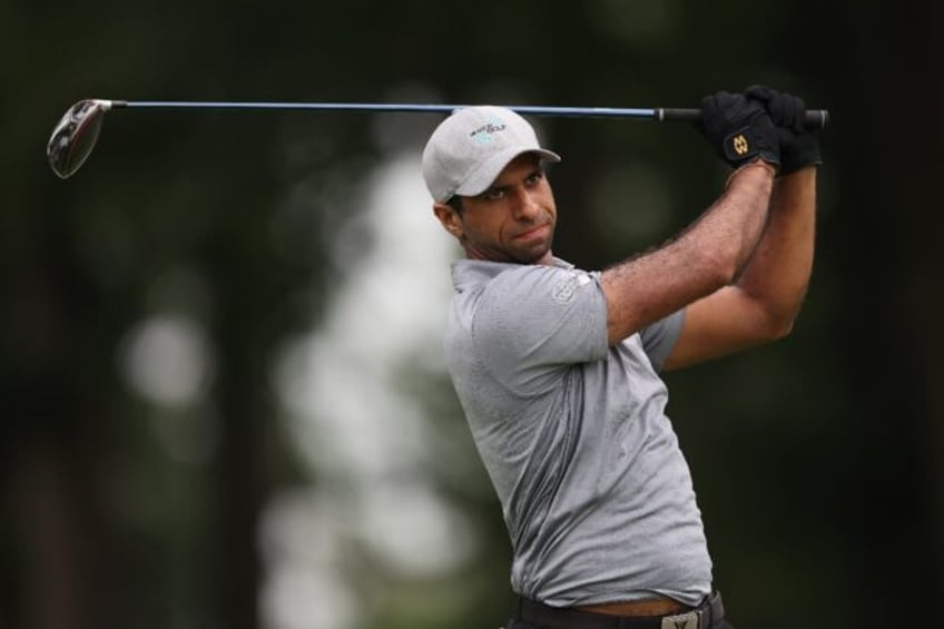 England's Aaron Rai closed with back-to-back birdies to grab a share of the lead after two