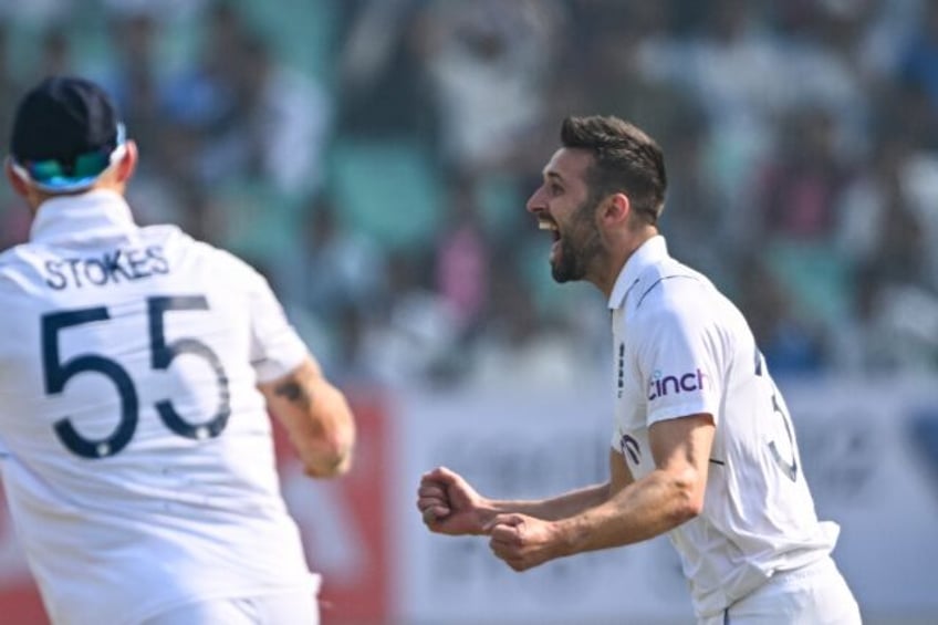 Mark Wood celebrates the wicket of Shubman Gill