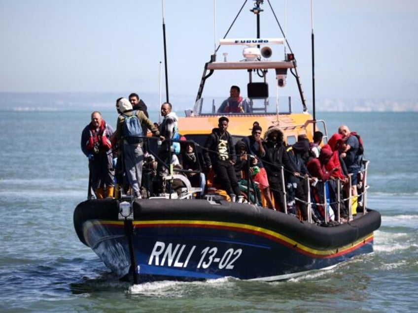 english channel four people smugglers held over deadly migrant boat disaster