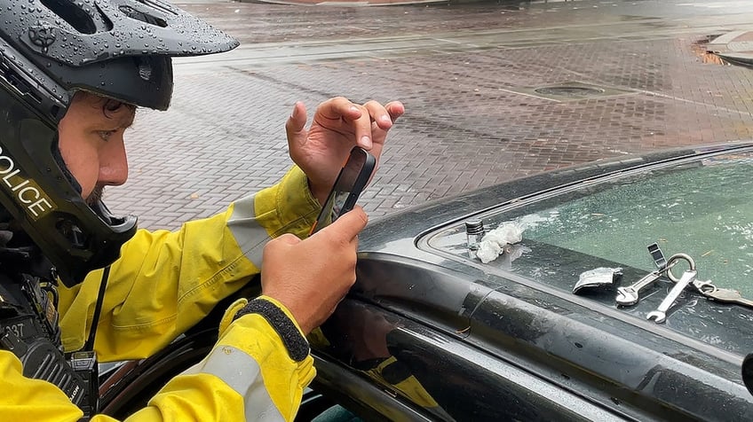 Bike squad officer photographs fentanyl he set on top of a Subaru