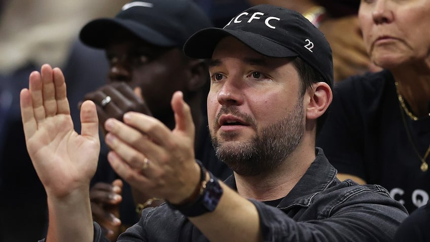 Alexis Ohanian reacts during a tennis game