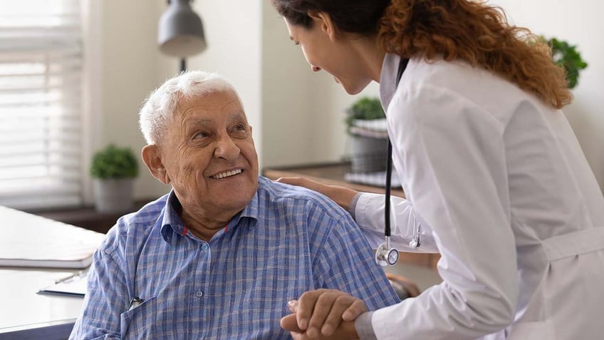 man speaks with doctor