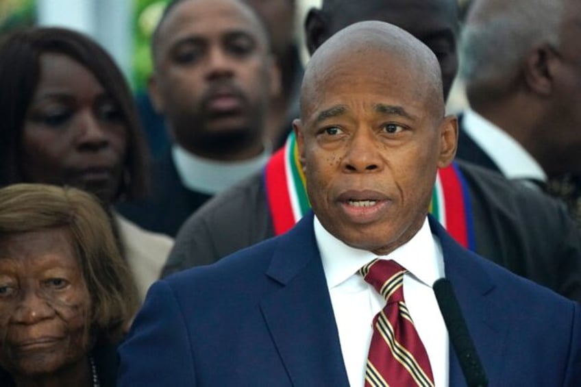 New York City Mayor Eric Adams talks to the press outside Gracie Mansion, the official re